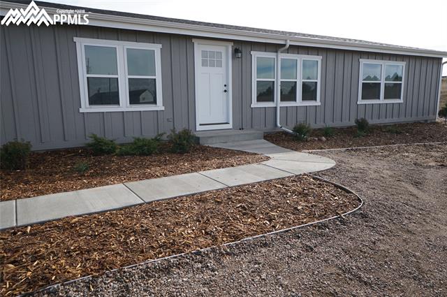 13745 Woodlake Road Elbert, CO 80106 - Photo 34 of 36 New cement/fiber siding exterior with new landscaping.