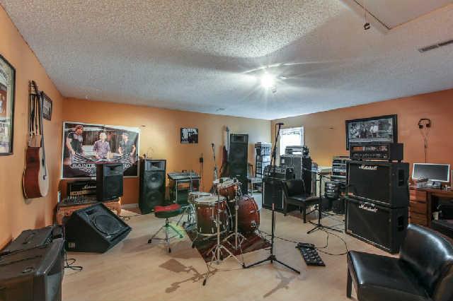 2141 Spring Hill Circle Spring Hill, TN 37174 - Photo 11 of 14 Spacious bonus room presently used for practice sessions for musicians. Would make a great media/play room.
