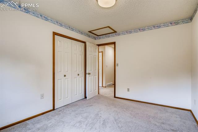 7575 Tobin Road Colorado Springs, CO 80908 - Photo 12 of 27 Another view of 2nd bedroom