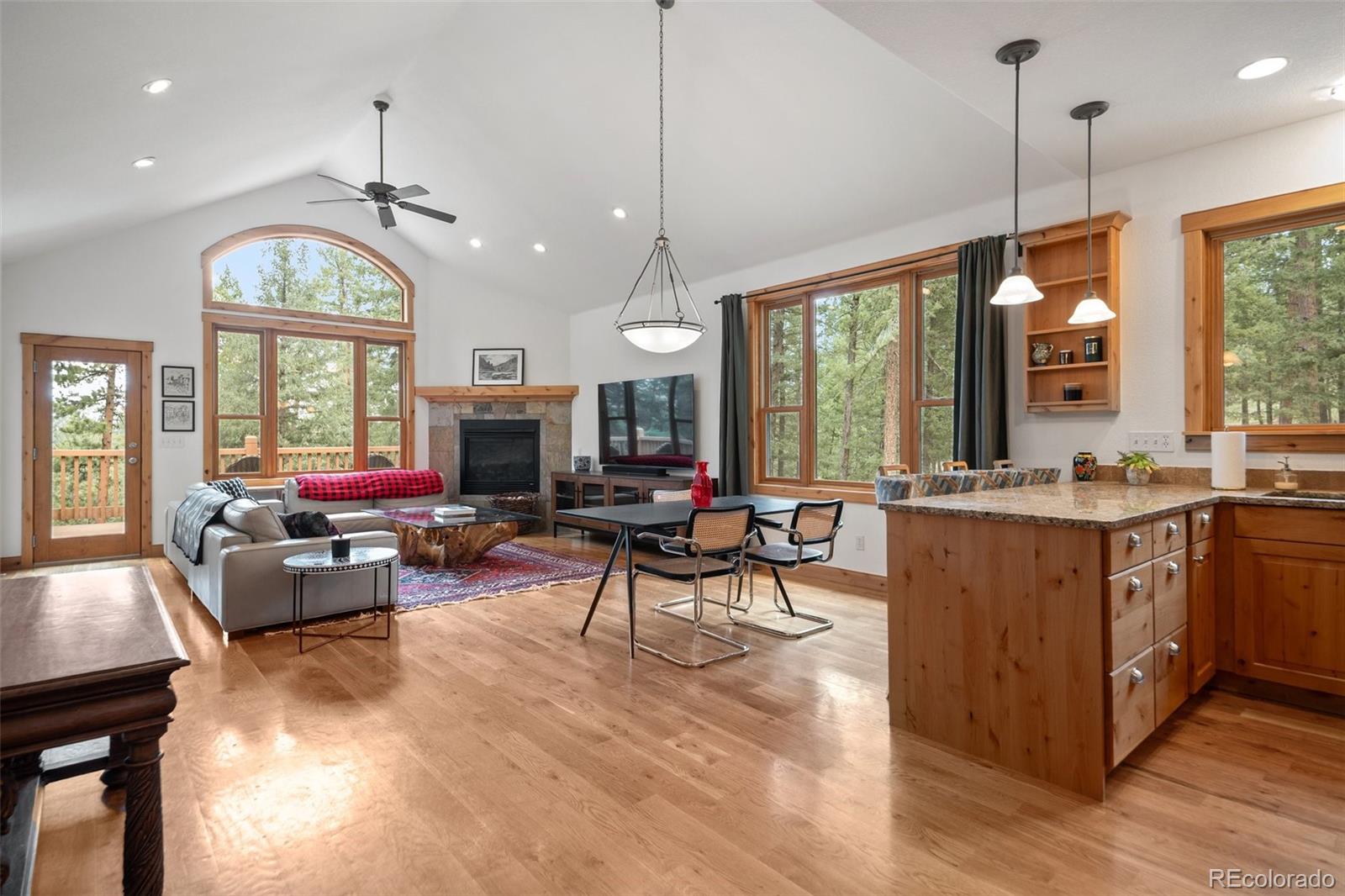 a living room with furniture window and flat screen tv