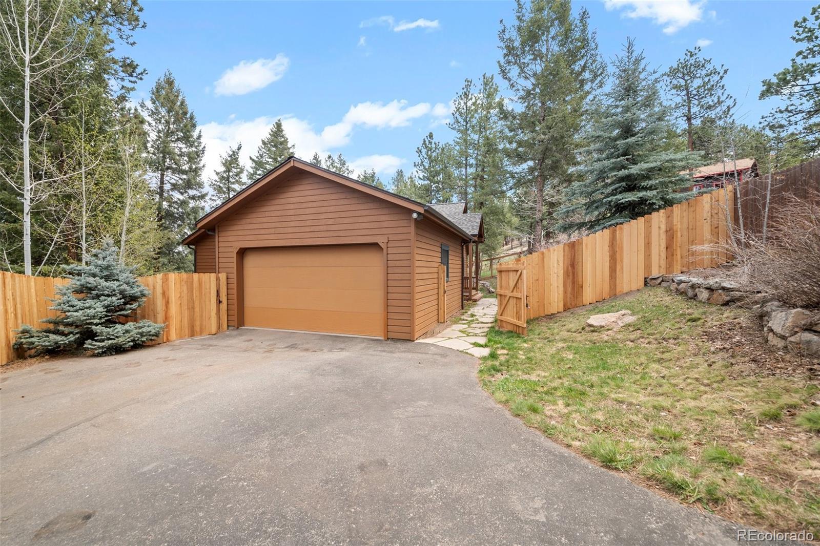 27711 Moffat Road Evergreen, CO 80439 - Photo 27 of 30 a view of backyard of house