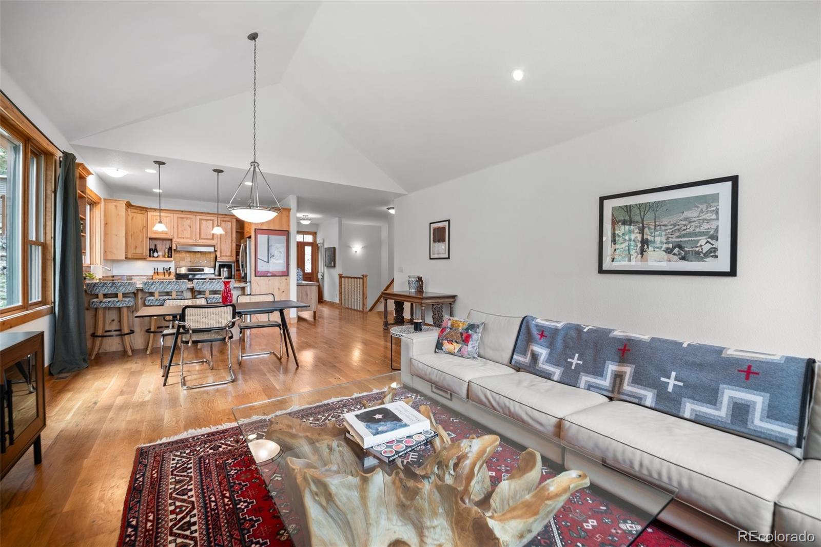 27711 Moffat Road Evergreen, CO 80439 - Photo 8 of 30 a living room with furniture and wooden floor