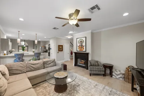 a large kitchen with stainless steel appliances lots of counter space and windows