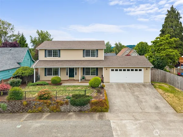 front view of a house with a garden