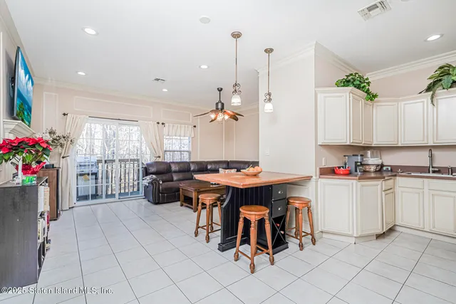 a kitchen with kitchen island granite countertop lots of counter top space and dining table