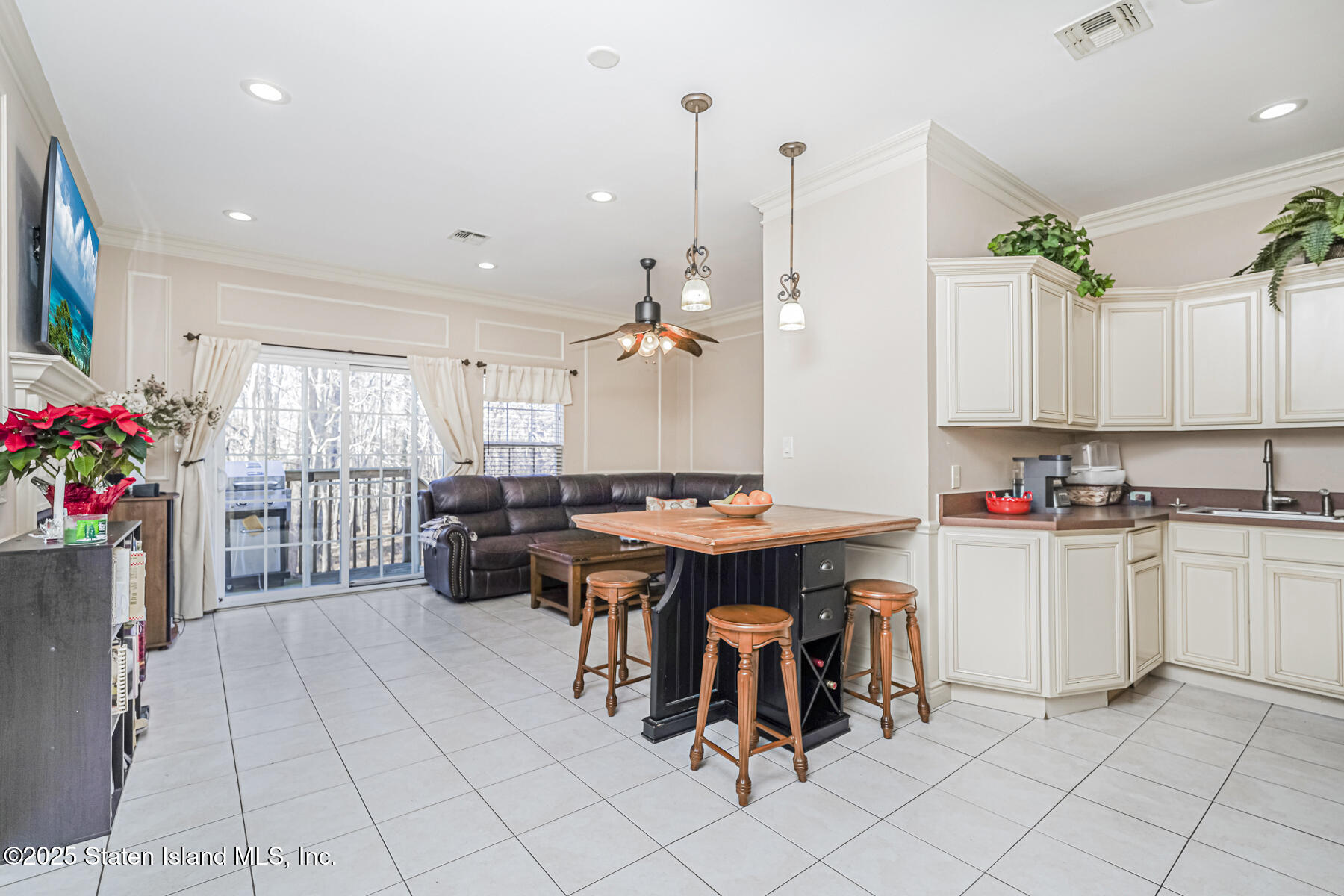 22 El Camino Loop Staten Island, NY 10309 - Photo 13 of 29 a kitchen with kitchen island granite countertop lots of counter top space and dining table