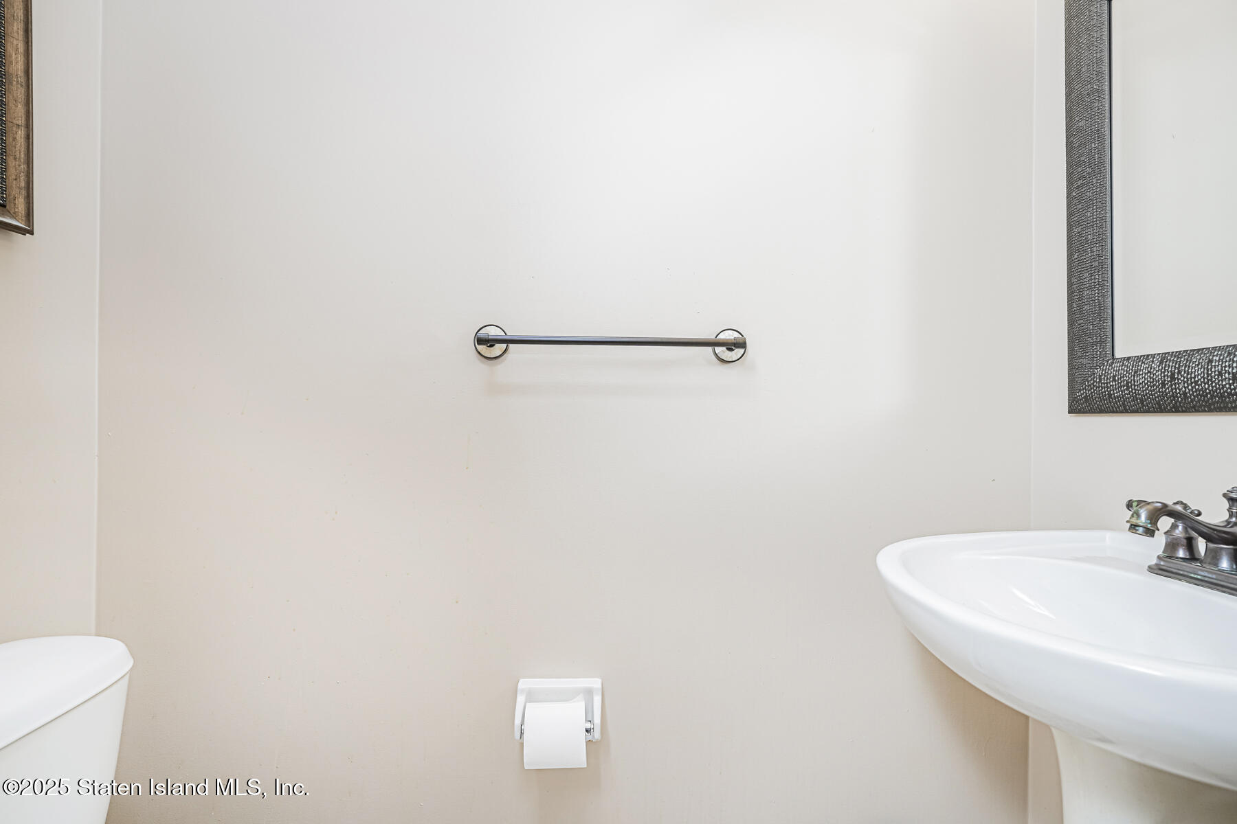 22 El Camino Loop Staten Island, NY 10309 - Photo 14 of 29 a bathroom with a sink and a toilet
