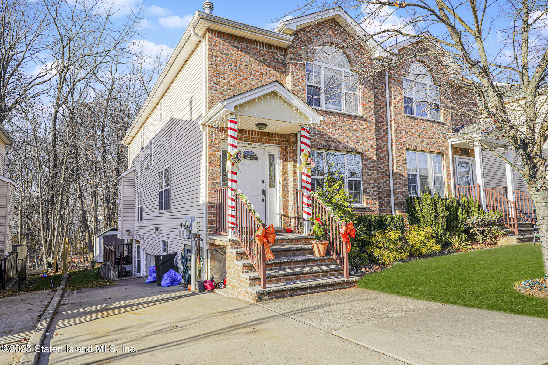 22 El Camino Loop Staten Island, NY 10309 - Photo 2 of 29 a view of road and small yard