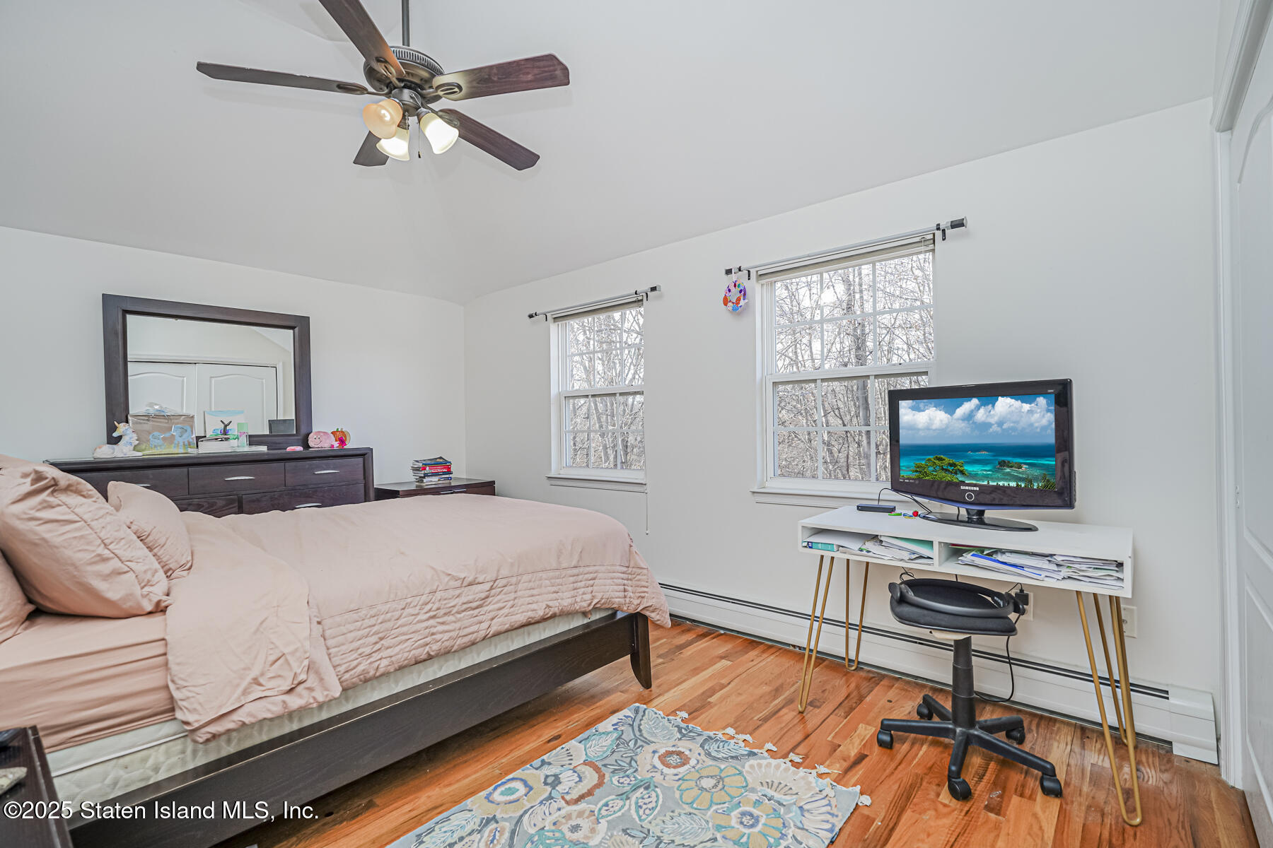 22 El Camino Loop Staten Island, NY 10309 - Photo 22 of 29 a bedroom with a bed and a flat screen tv