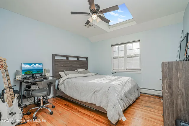 a bedroom with a bed and a desk