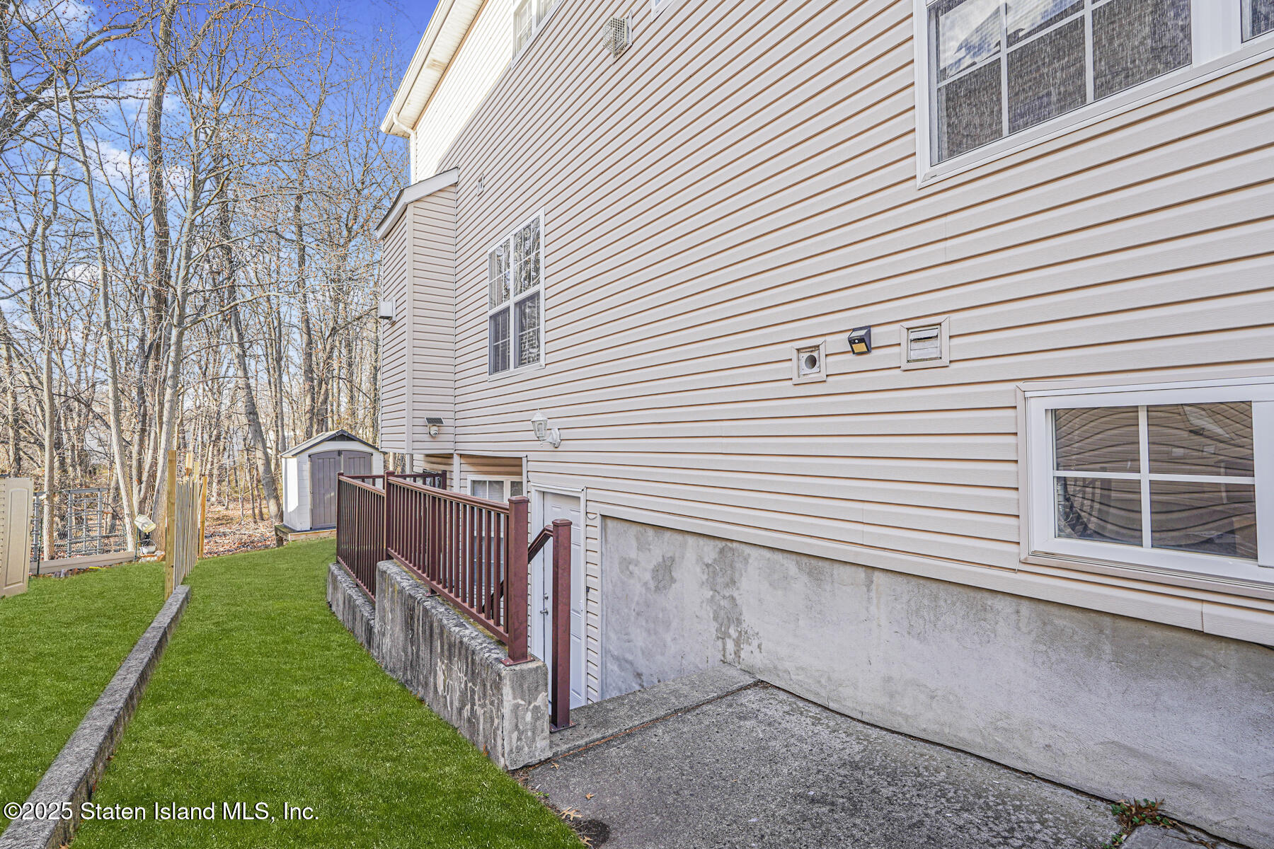 22 El Camino Loop Staten Island, NY 10309 - Photo 26 of 29 a view of a house with a yard and stairs