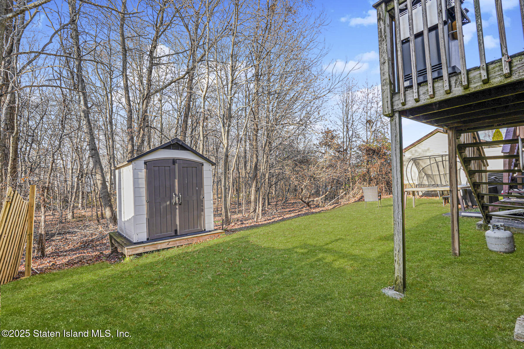 22 El Camino Loop Staten Island, NY 10309 - Photo 27 of 29 a front view of a house with garden