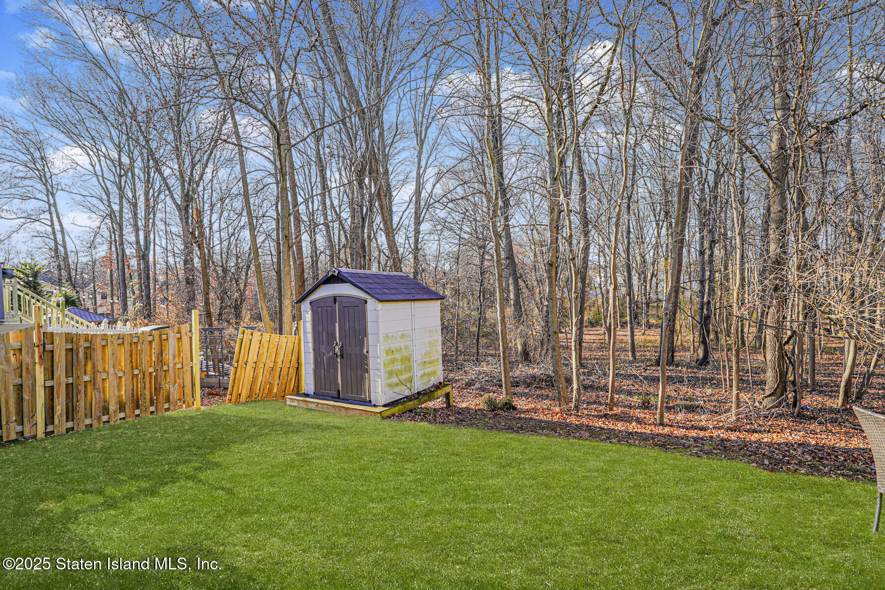 22 El Camino Loop Staten Island, NY 10309 - Photo 28 of 29 a backyard of a house with lots of green space