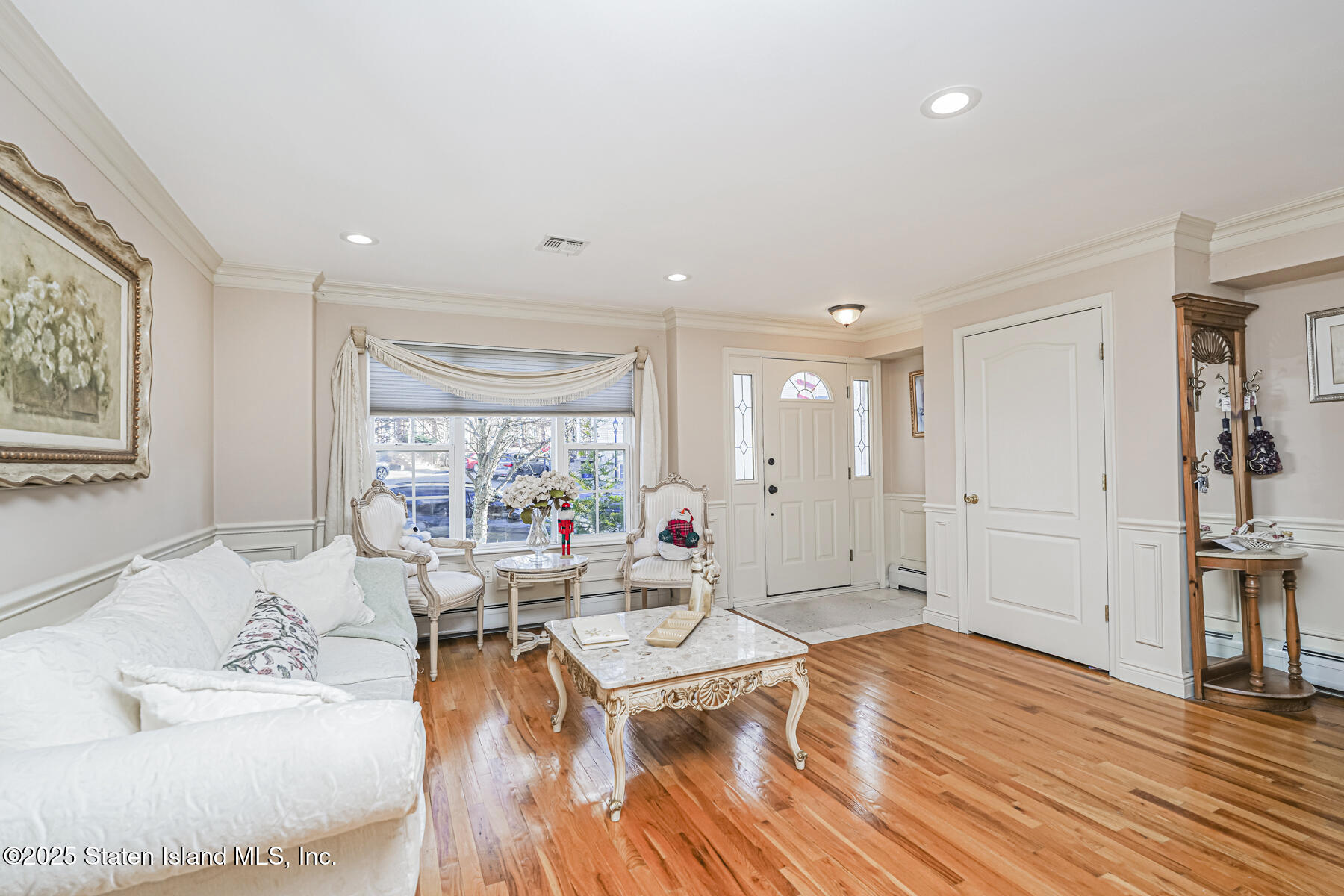 22 El Camino Loop Staten Island, NY 10309 - Photo 3 of 29 a living room with furniture and large windows