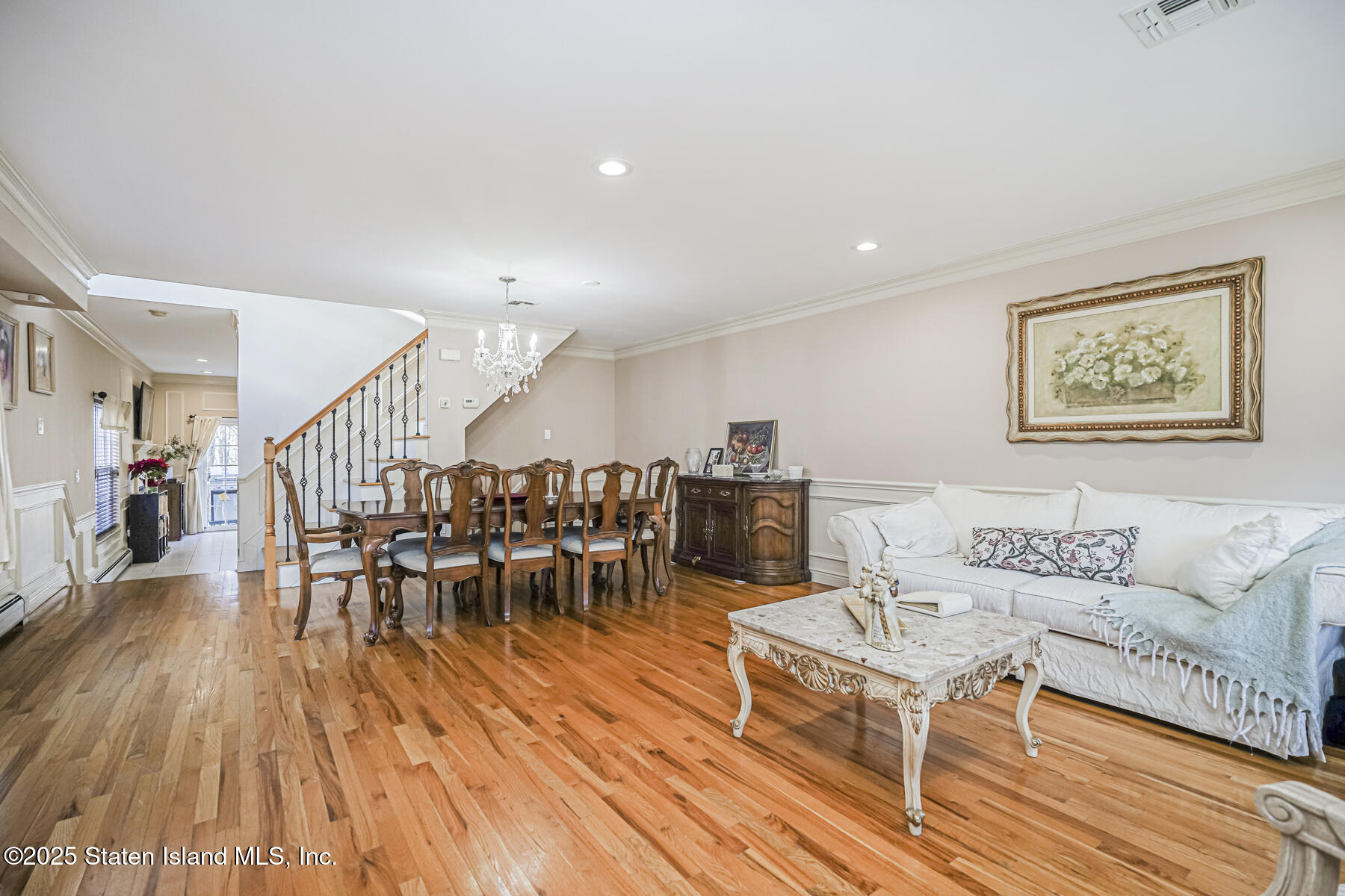 22 El Camino Loop Staten Island, NY 10309 - Photo 4 of 29 a living room with furniture and a wooden floor