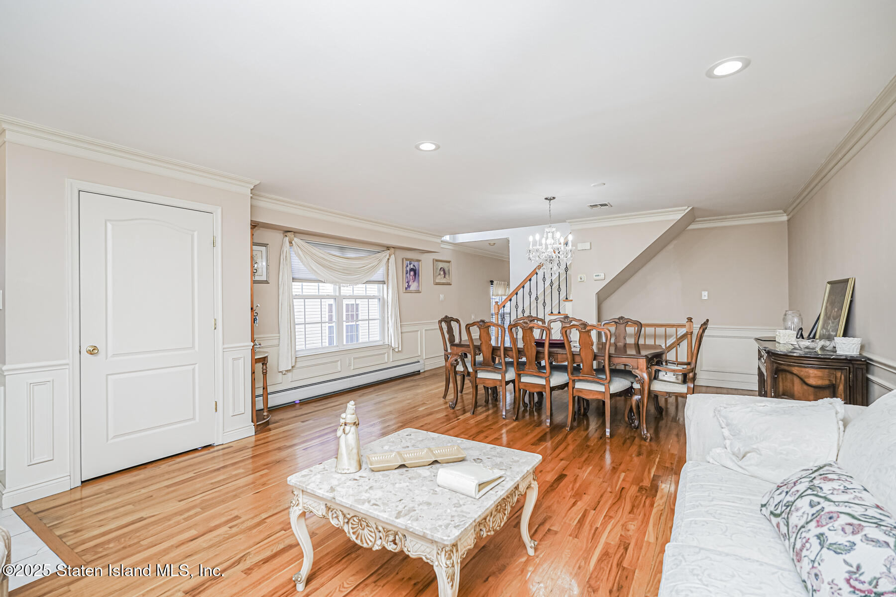 22 El Camino Loop Staten Island, NY 10309 - Photo 5 of 29 a dining room with furniture and wooden floor