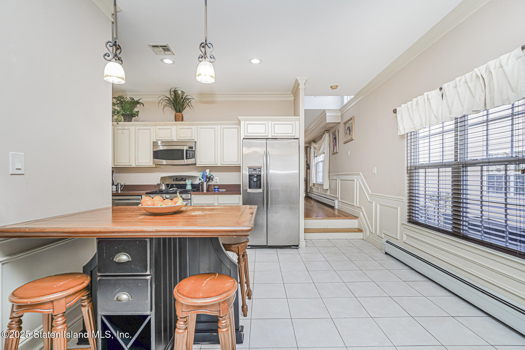 22 El Camino Loop Staten Island, NY 10309 - Photo 10 of 29 a kitchen with stainless steel appliances granite countertop a sink a stove and a refrigerator