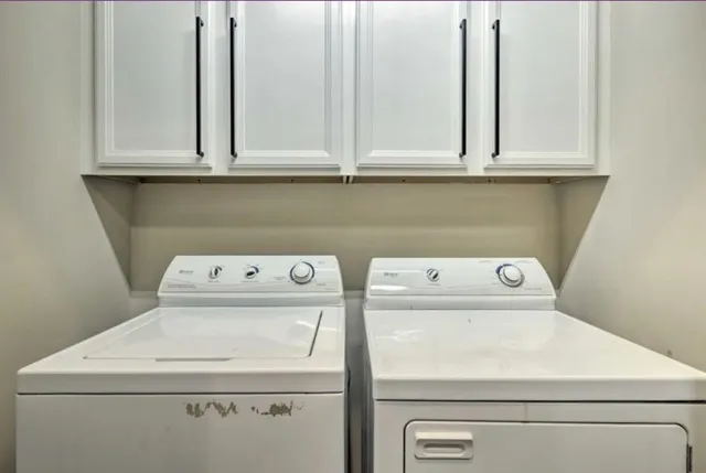 a bedroom with a bed and a television