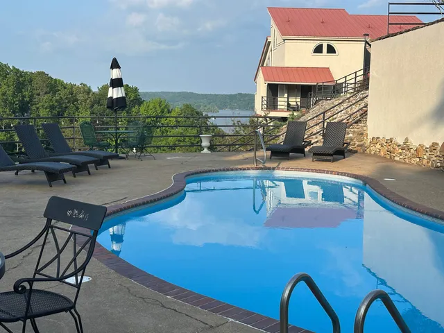 a backyard of a house with outdoor seating