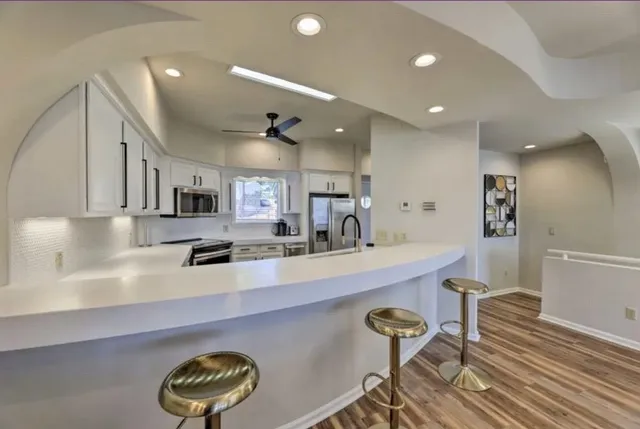 a living room with furniture fireplace and a flat screen tv