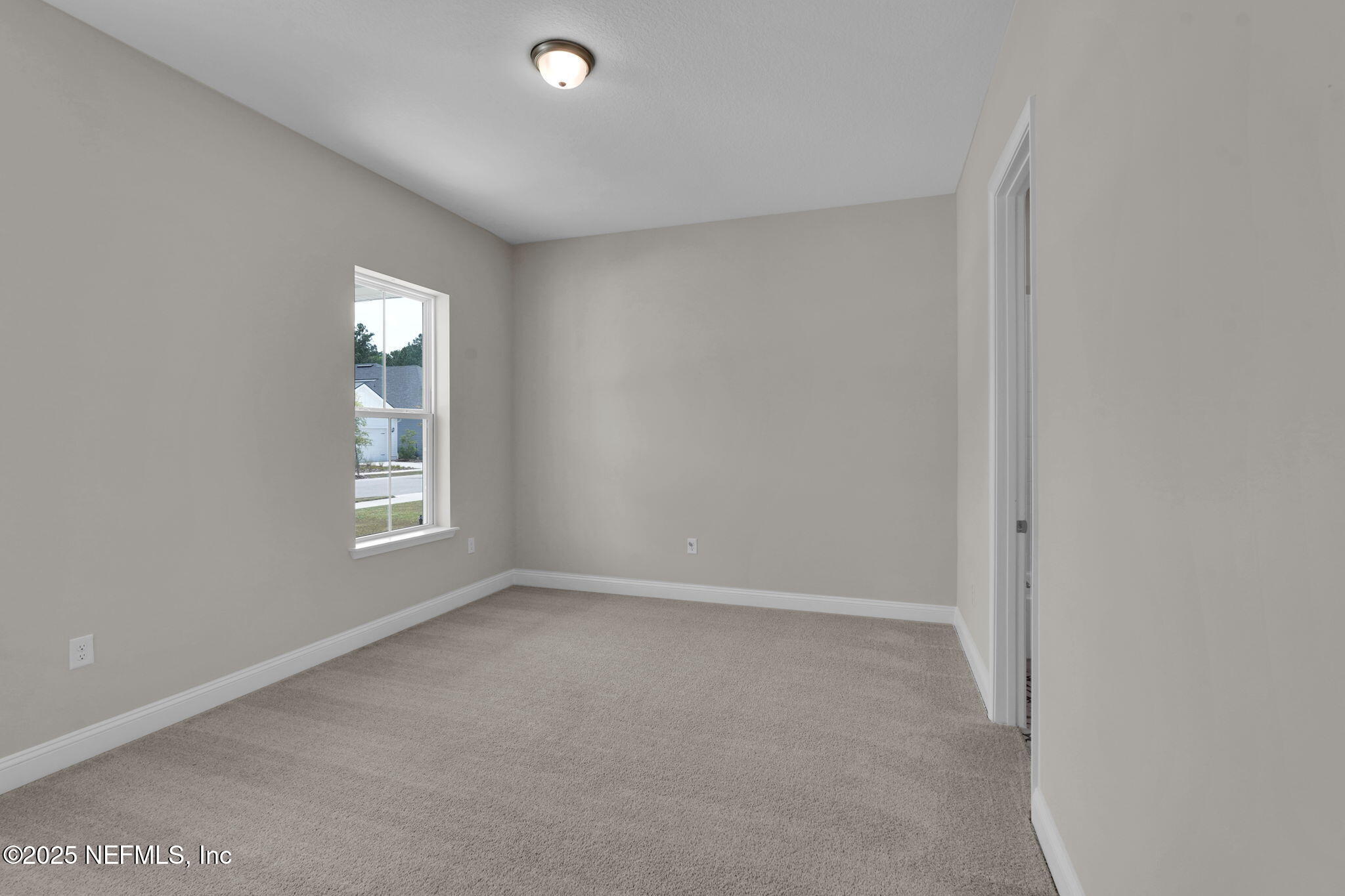 323 Sawgrass Drive Yulee, FL 32097 - Photo 11 of 48 a view of an empty room with a window