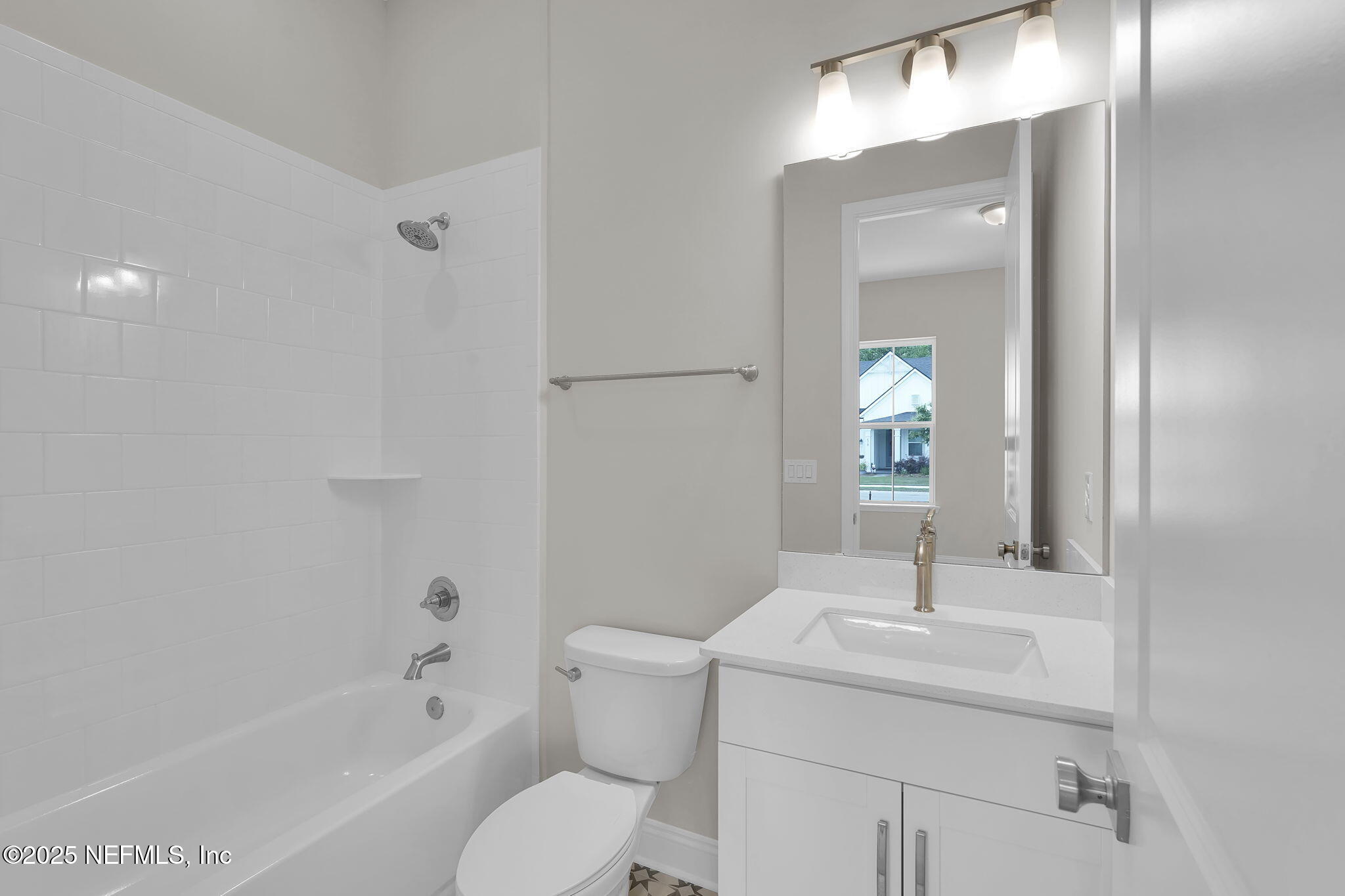 323 Sawgrass Drive Yulee, FL 32097 - Photo 13 of 48 a bathroom with a sink toilet and shower