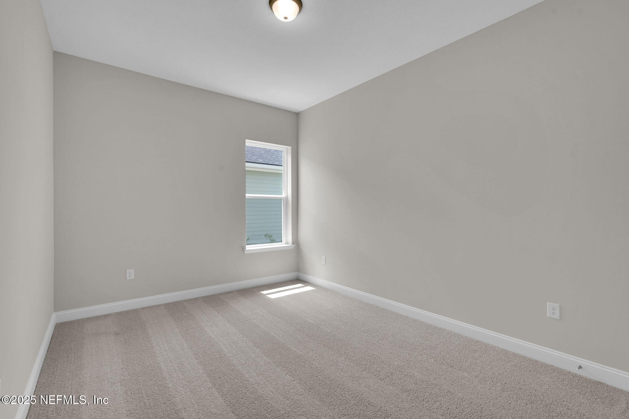 323 Sawgrass Drive Yulee, FL 32097 - Photo 15 of 48 a view of an empty room with a window