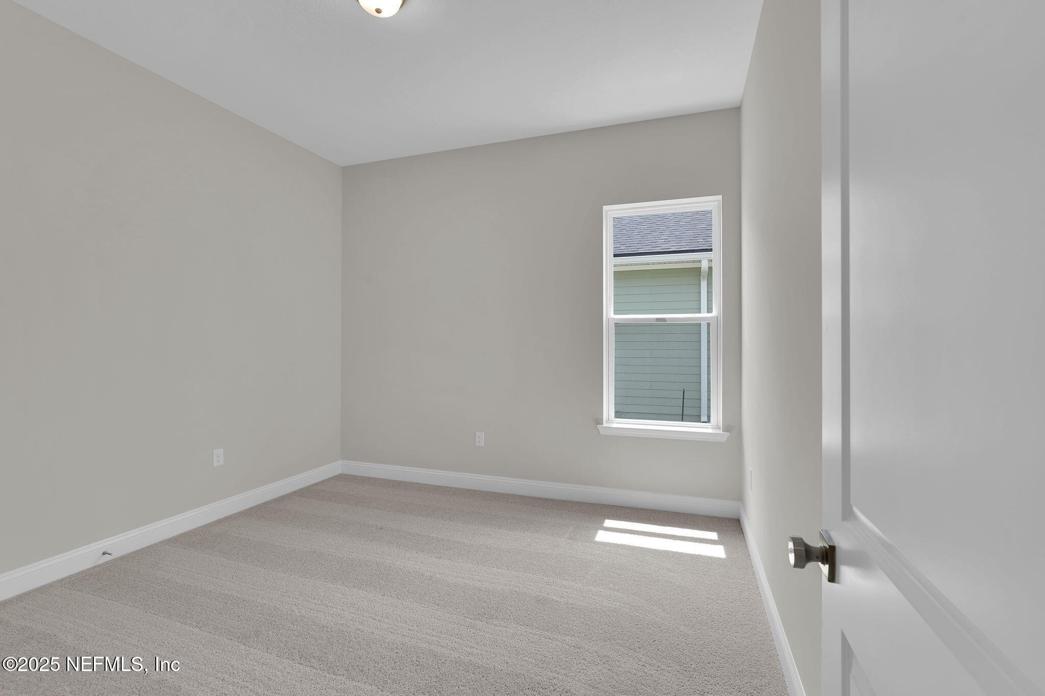 323 Sawgrass Drive Yulee, FL 32097 - Photo 16 of 48 an empty room with a window