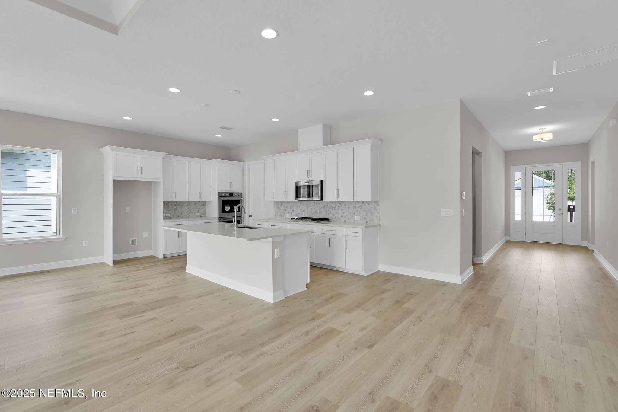 323 Sawgrass Drive Yulee, FL 32097 - Photo 19 of 48 a view of kitchen with wooden floor and window