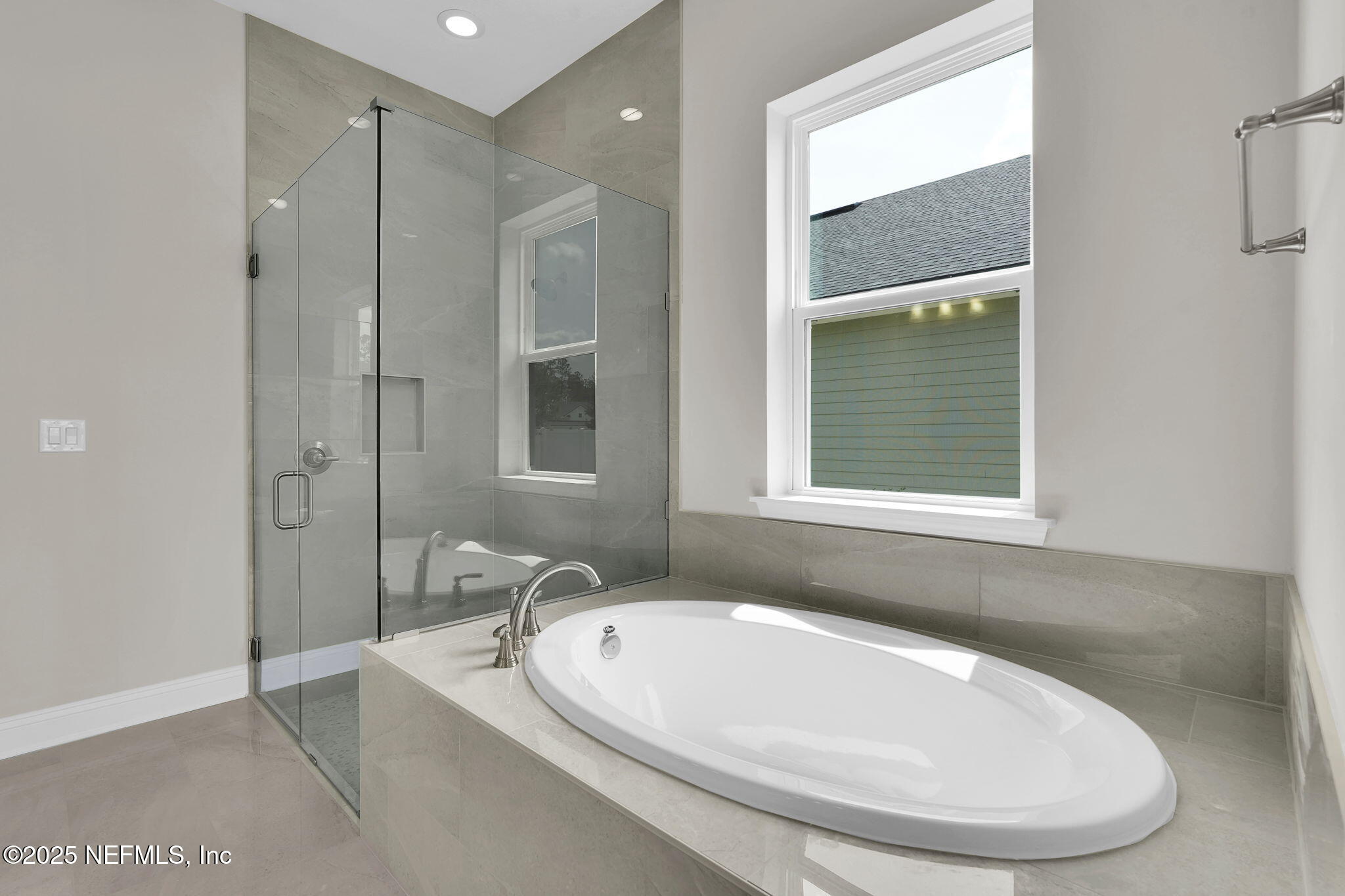 323 Sawgrass Drive Yulee, FL 32097 - Photo 30 of 48 a bathroom with a sink and a bathtub