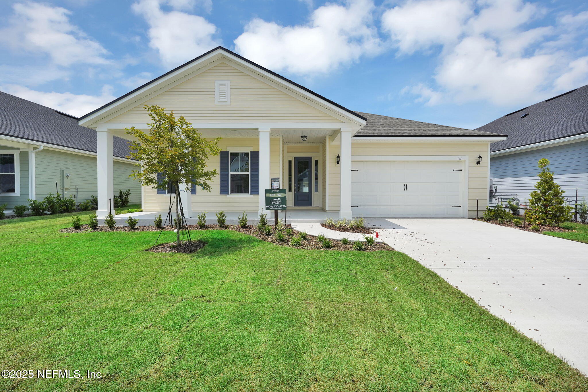 323 Sawgrass Drive Yulee, FL 32097 - Photo 3 of 48 a view of a house with a yard patio and fire pit