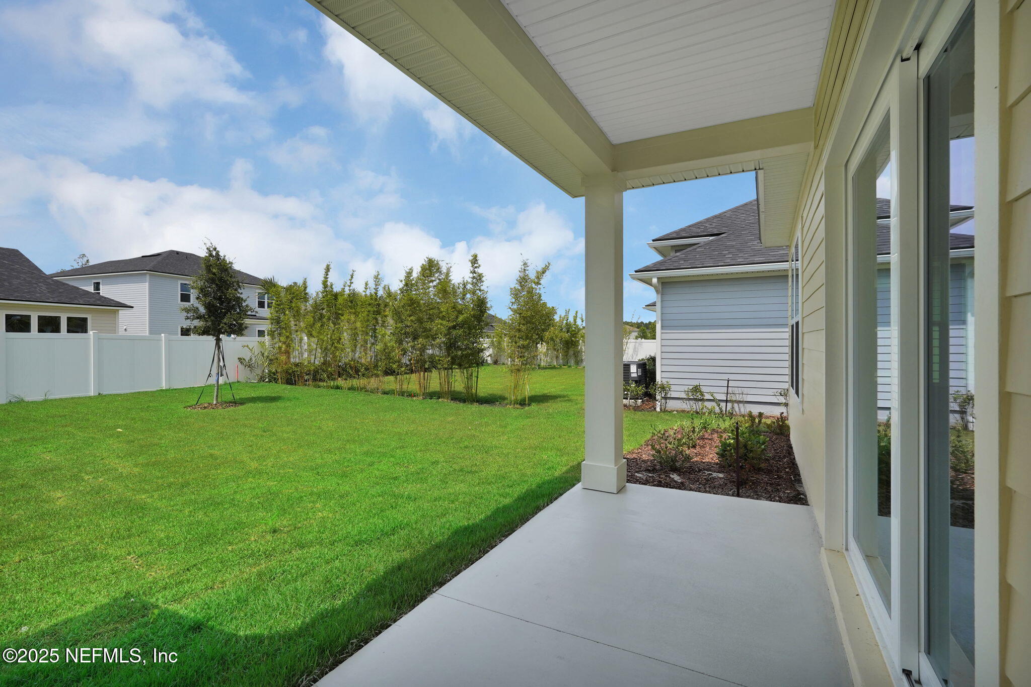 323 Sawgrass Drive Yulee, FL 32097 - Photo 32 of 48 a view of house with backyard and garden