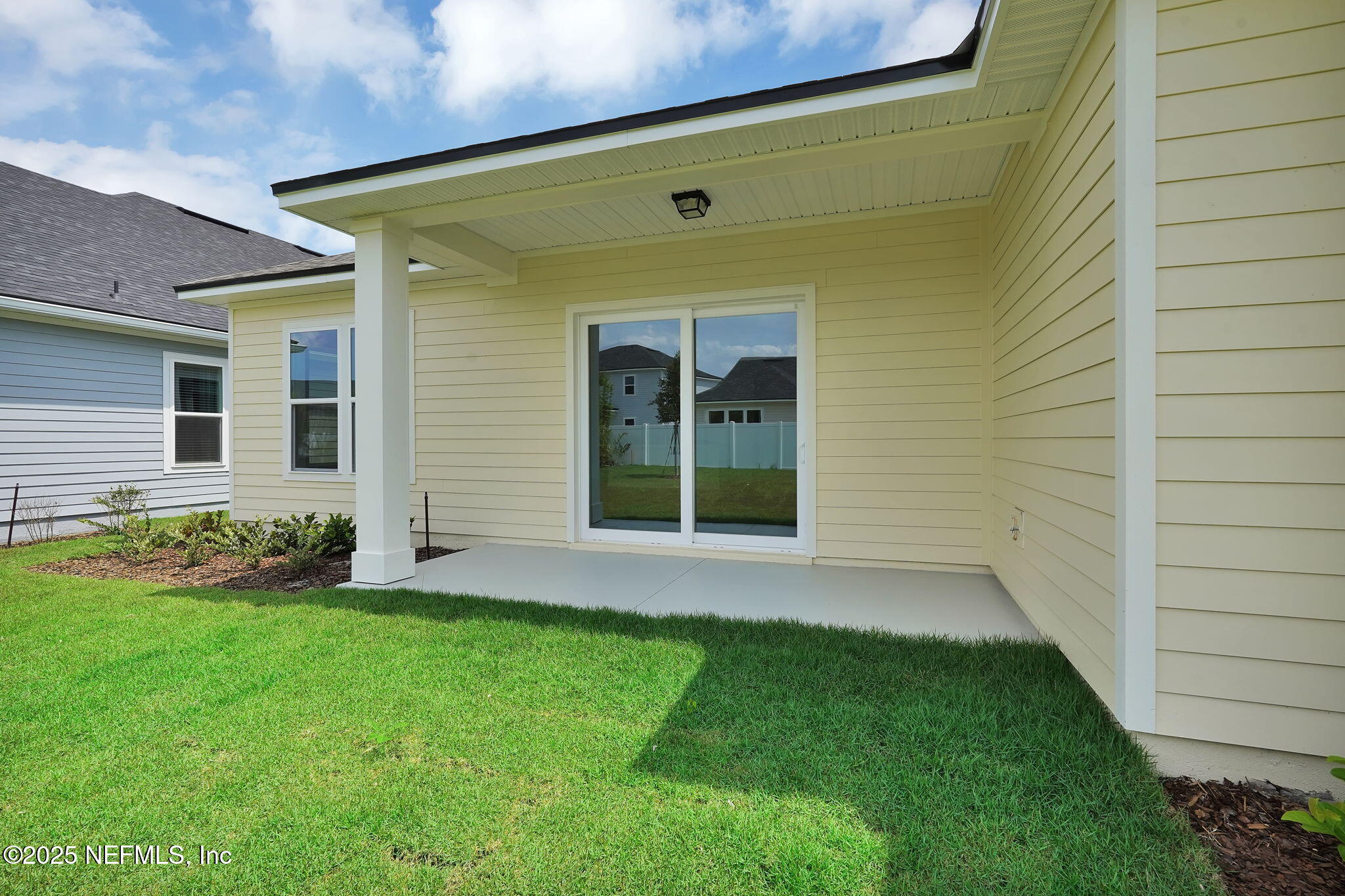 323 Sawgrass Drive Yulee, FL 32097 - Photo 33 of 48 a front view of a house with garden
