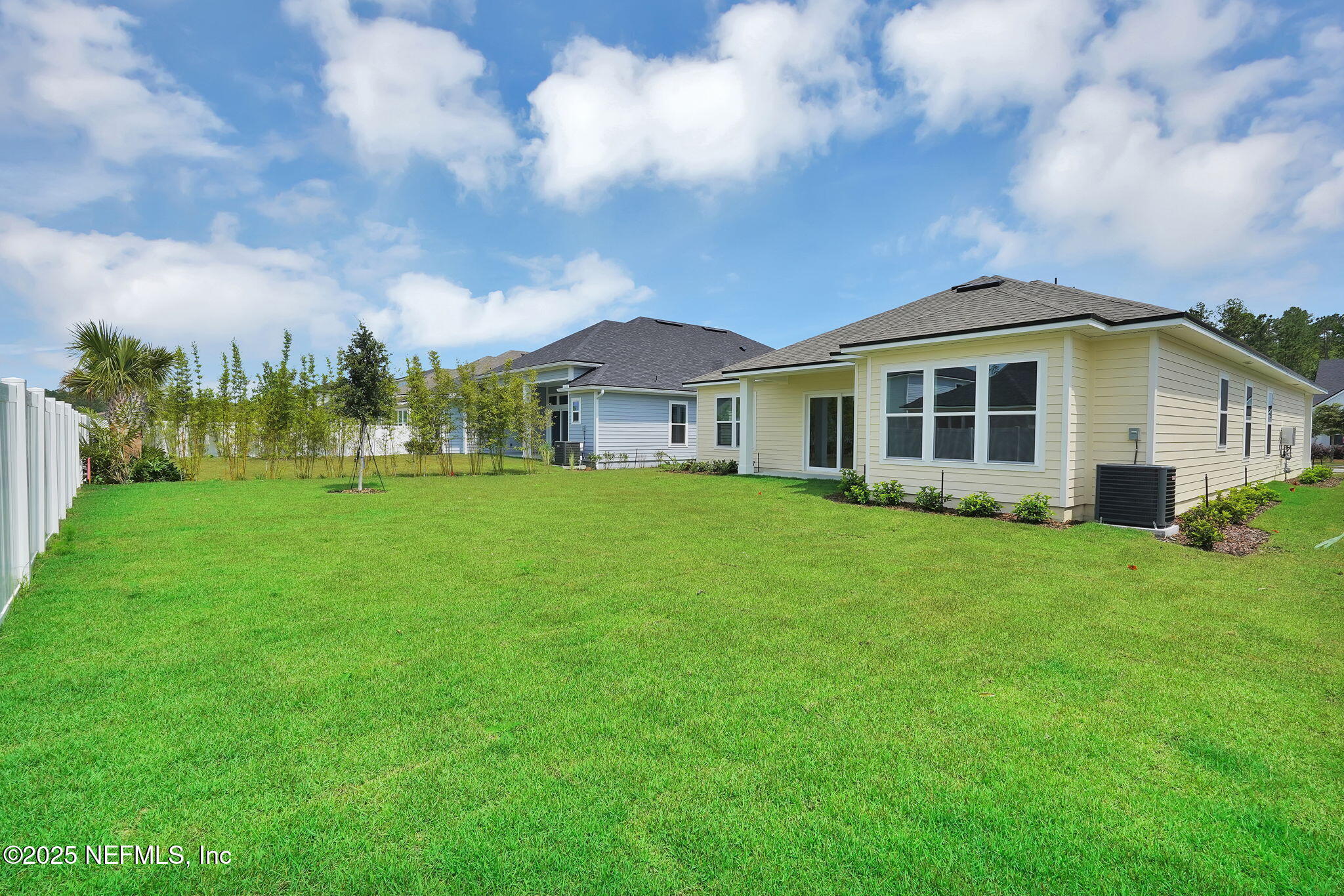 323 Sawgrass Drive Yulee, FL 32097 - Photo 36 of 48 a view of a house with yard and green space