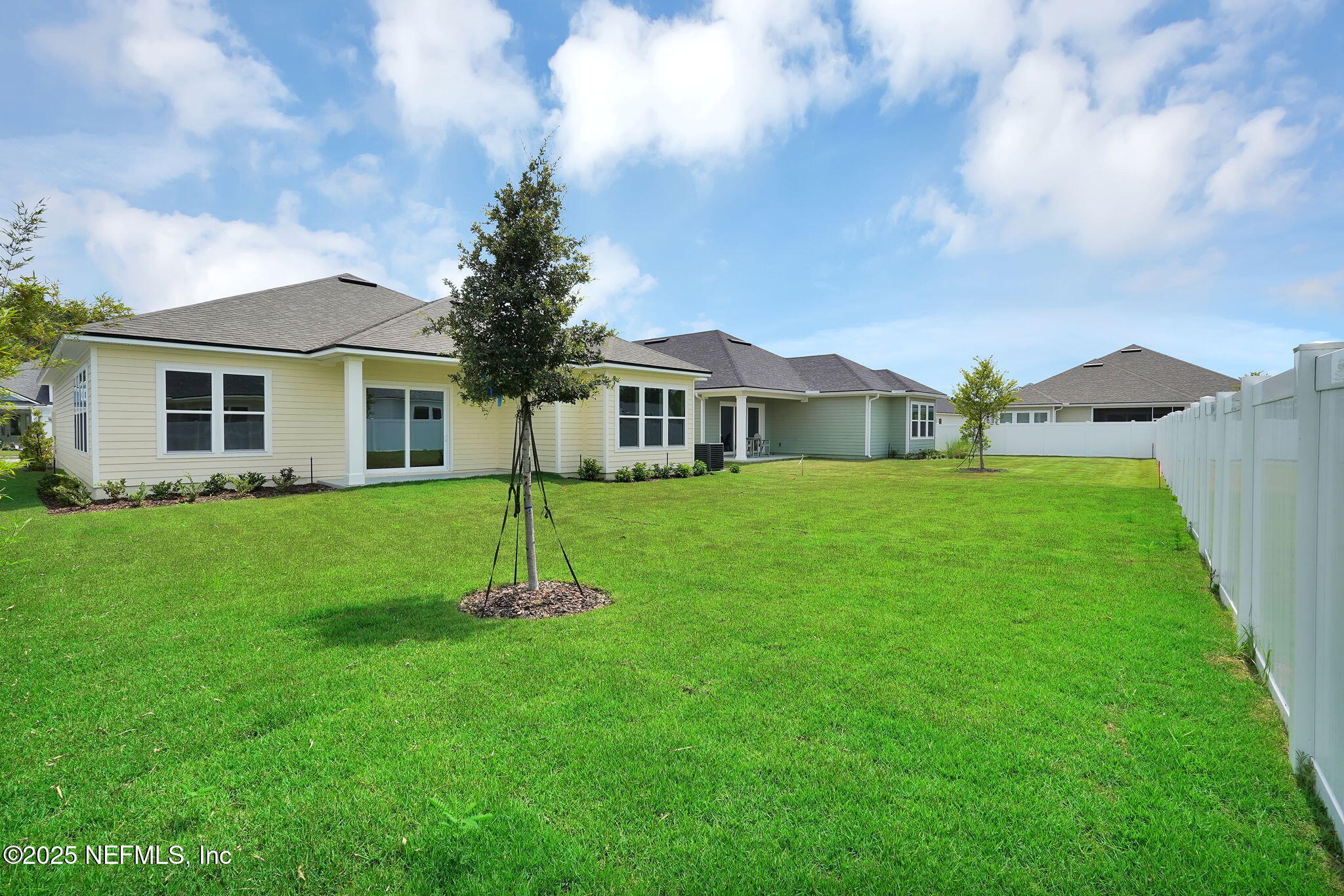 323 Sawgrass Drive Yulee, FL 32097 - Photo 37 of 48 a front view of a house with a yard