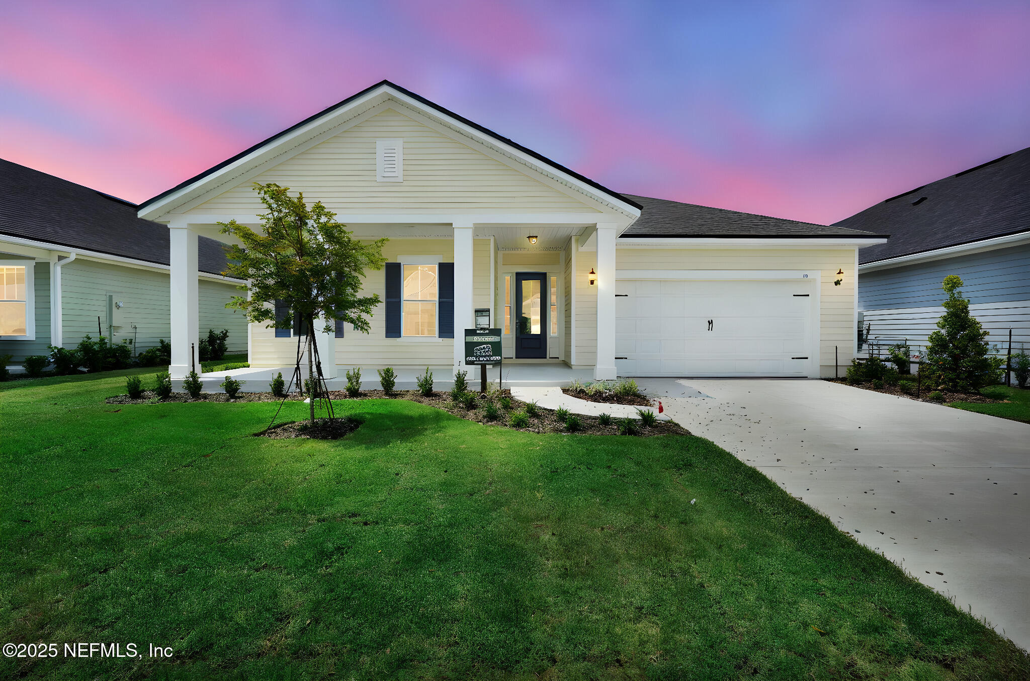 323 Sawgrass Drive Yulee, FL 32097 - Photo 38 of 48 a front view of a house with a yard and porch