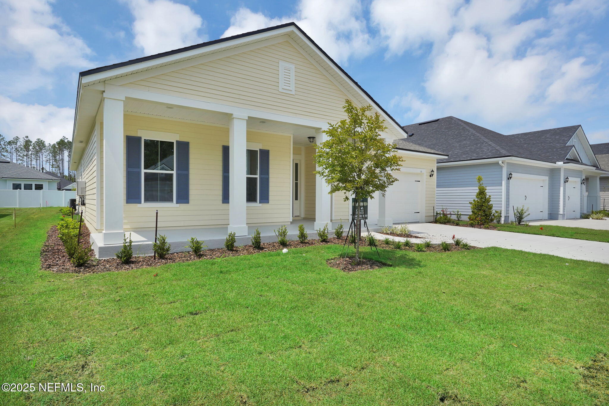 323 Sawgrass Drive Yulee, FL 32097 - Photo 5 of 48 a front view of a house with a yard