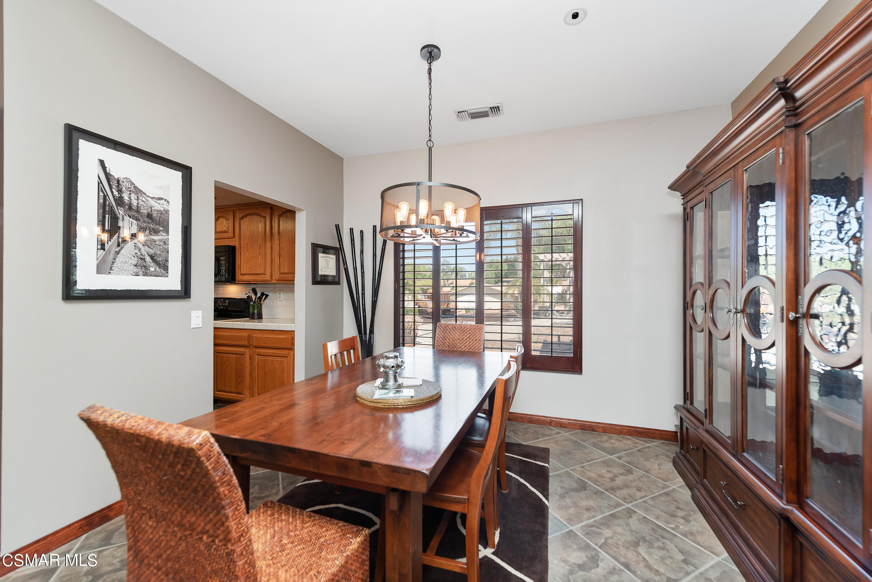 143 Wrangler Road Simi Valley, CA 93065 - Photo 14 of 77 a view of a dining room with furniture window and wooden floor