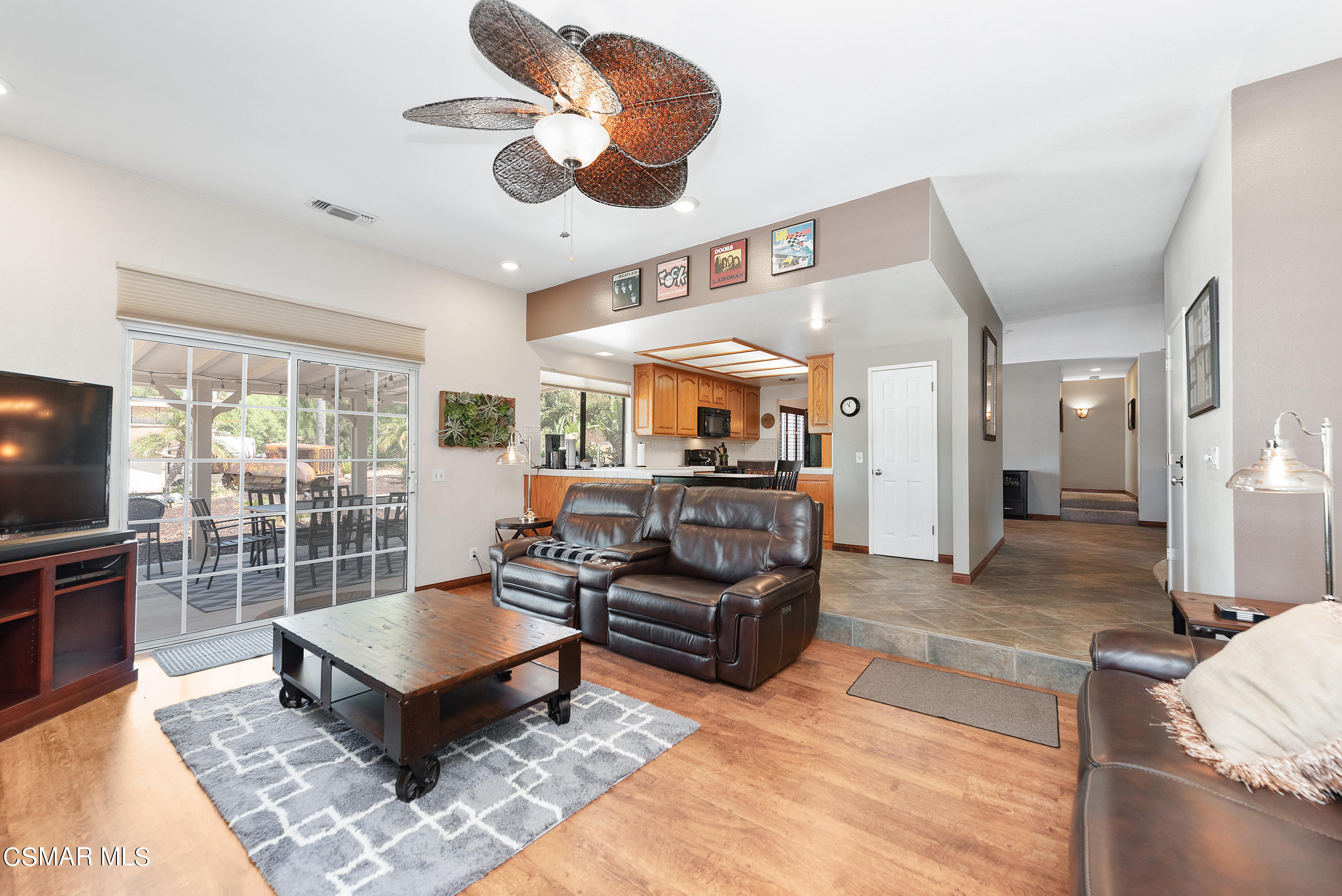 143 Wrangler Road Simi Valley, CA 93065 - Photo 22 of 77 a living room with furniture a flat screen tv and a table