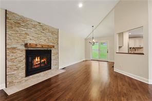 Living Rm with Fire Place open to Dining area.