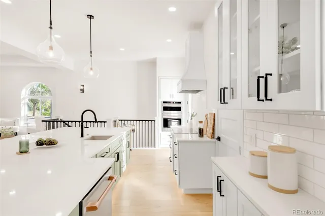 a kitchen with a sink appliances and a counter top space