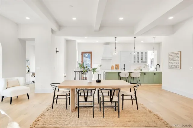 a dining room with a table and chairs