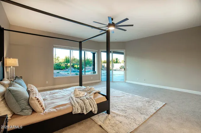 a living room with couch and a floor to ceiling window