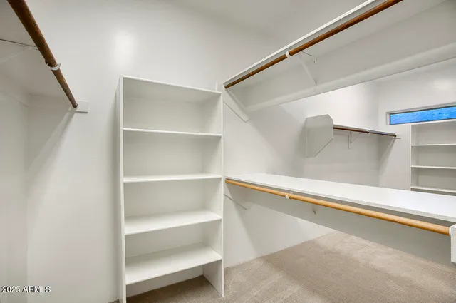 a view of an empty walk in closet