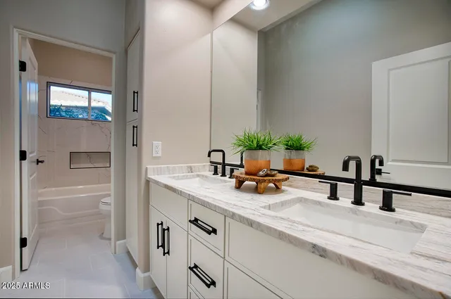 a kitchen with a sink and a refrigerator