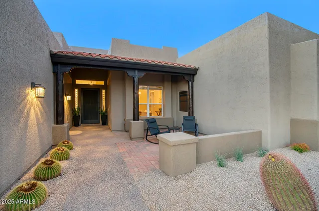 a view of a patio with couches and potted plants