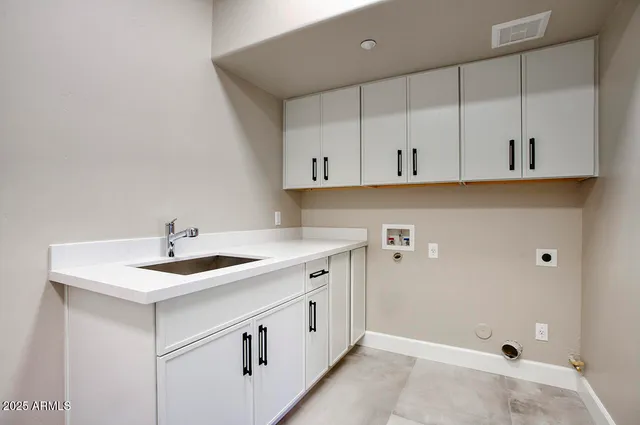 a view of a kitchen with cabinets