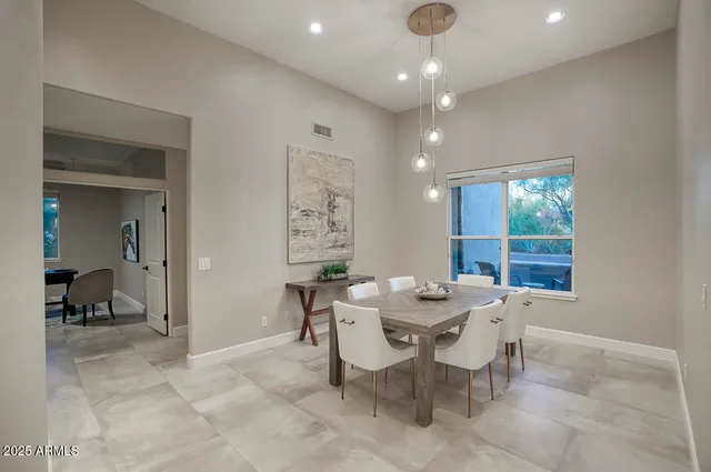 a view of a dining room with furniture window and outside view