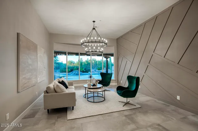 a work room with furniture and a floor to ceiling window