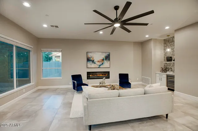 a living room with furniture and a large window